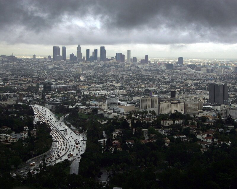 Los Angeles skyline under storm clouds