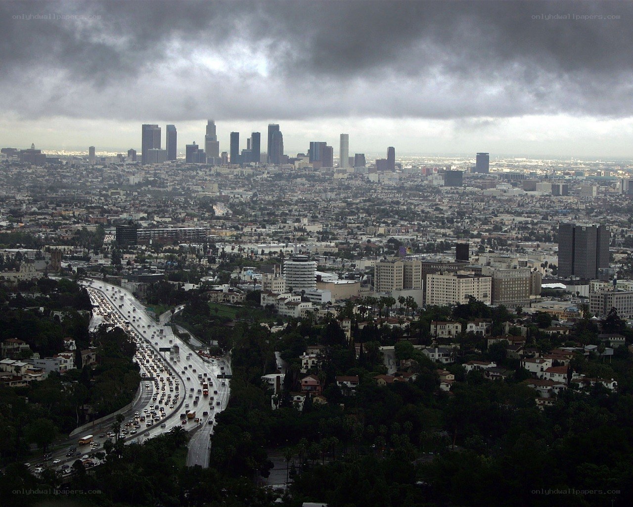 Los Angeles skyline under storm clouds