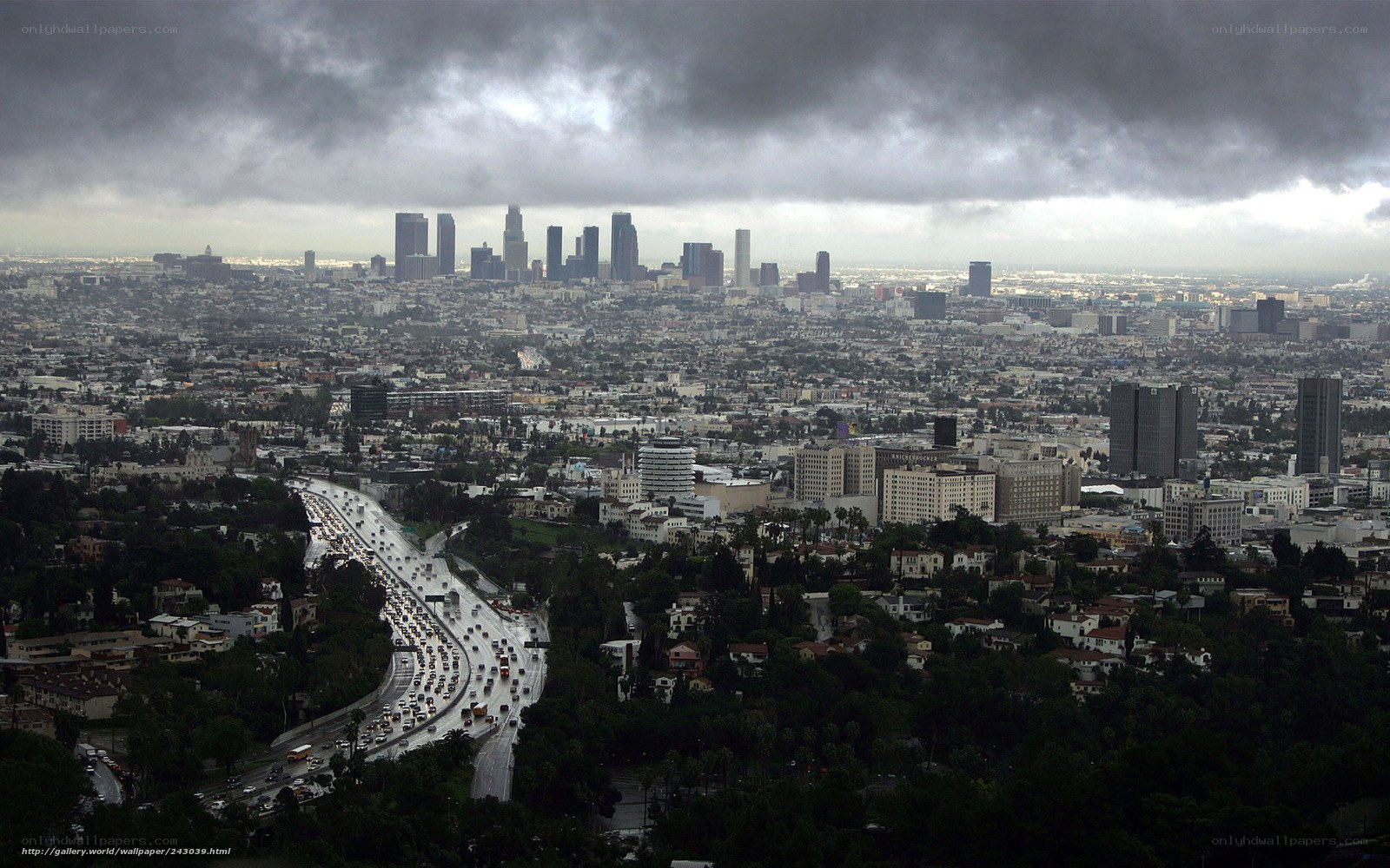 Los Angeles skyline under storm clouds