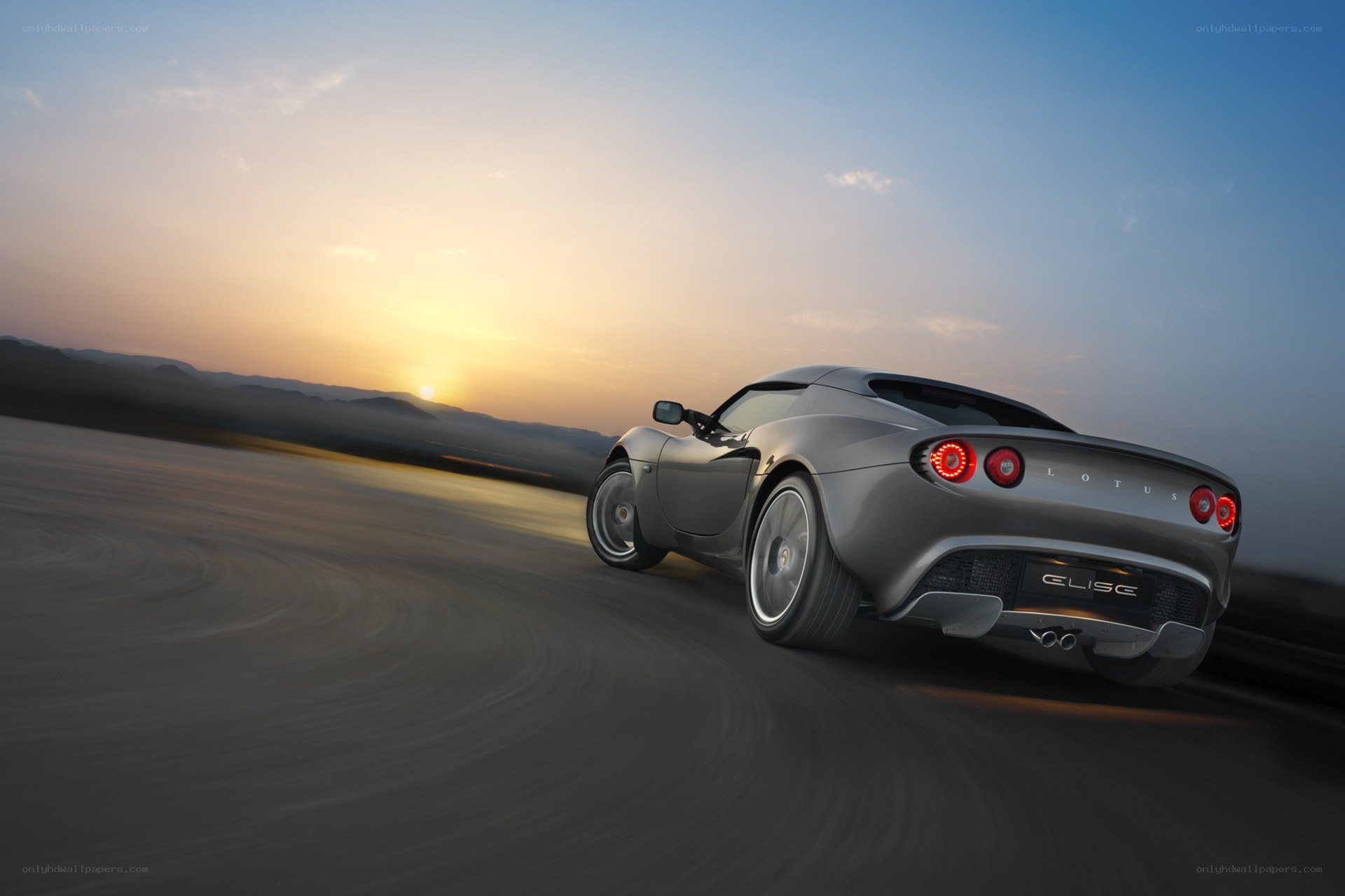 Lotus Elise driving at sunset