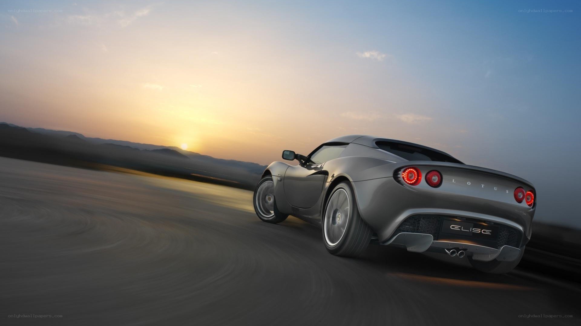 Lotus Elise driving at sunset