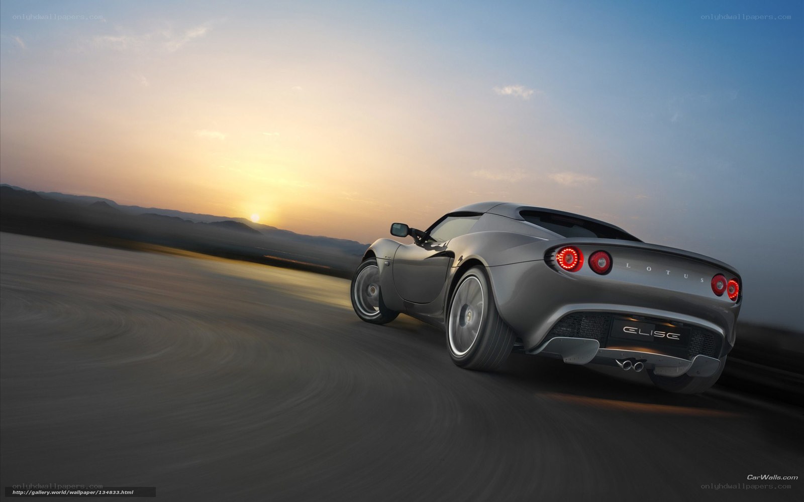 Lotus Elise driving at sunset