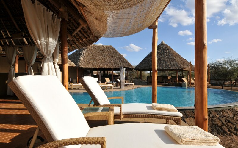 Lounge Chairs by Pool — Blue, Serene, Afternoon, Photograph, Thatched Roofs
