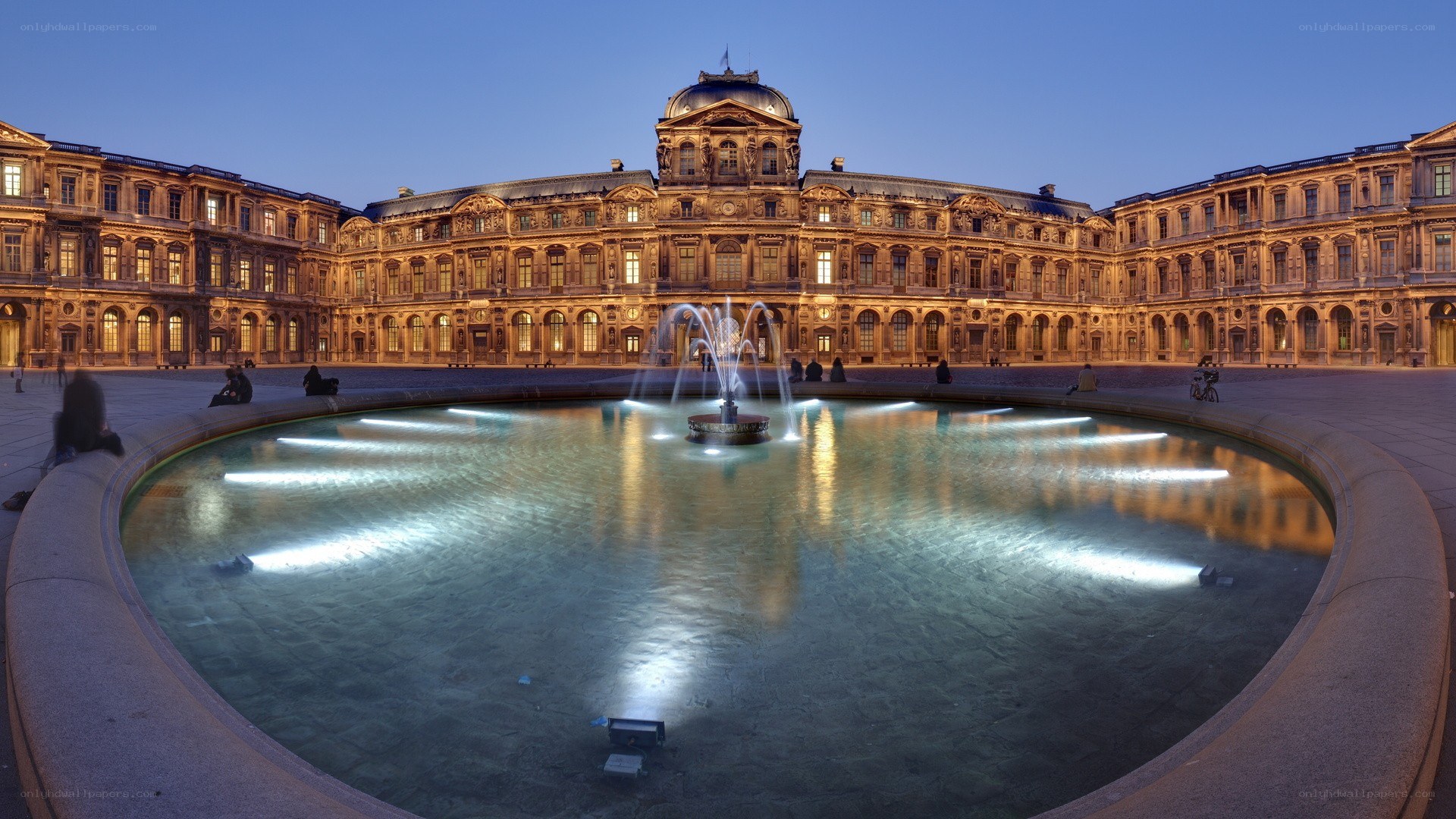Louvre courtyard at dusk