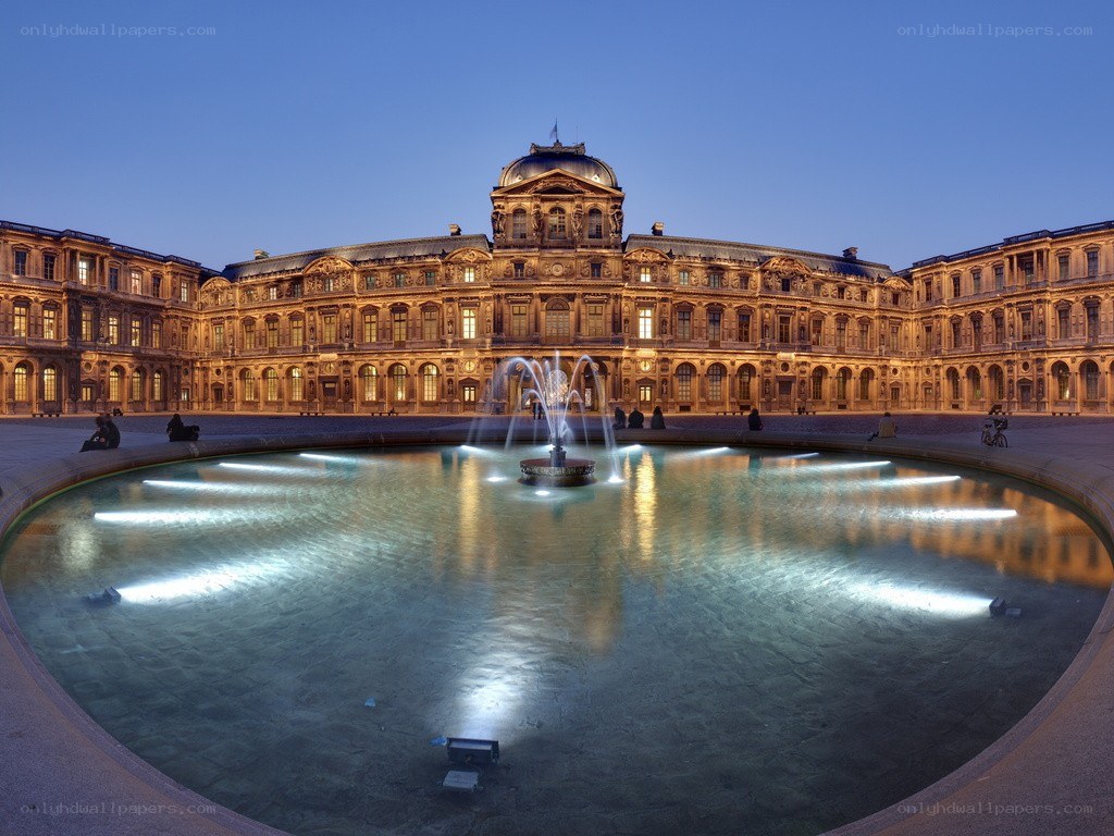 Louvre courtyard at dusk