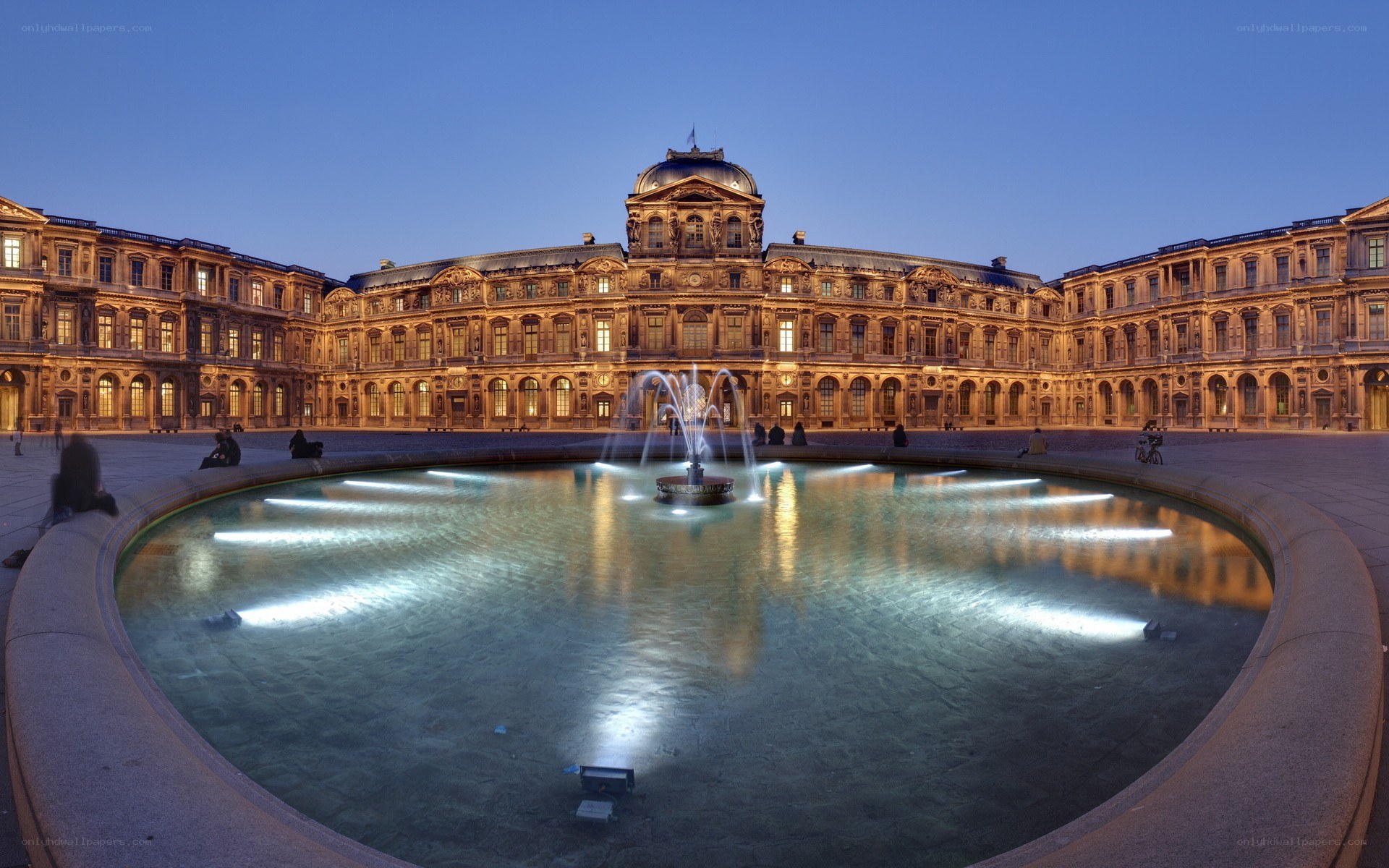Louvre courtyard at dusk