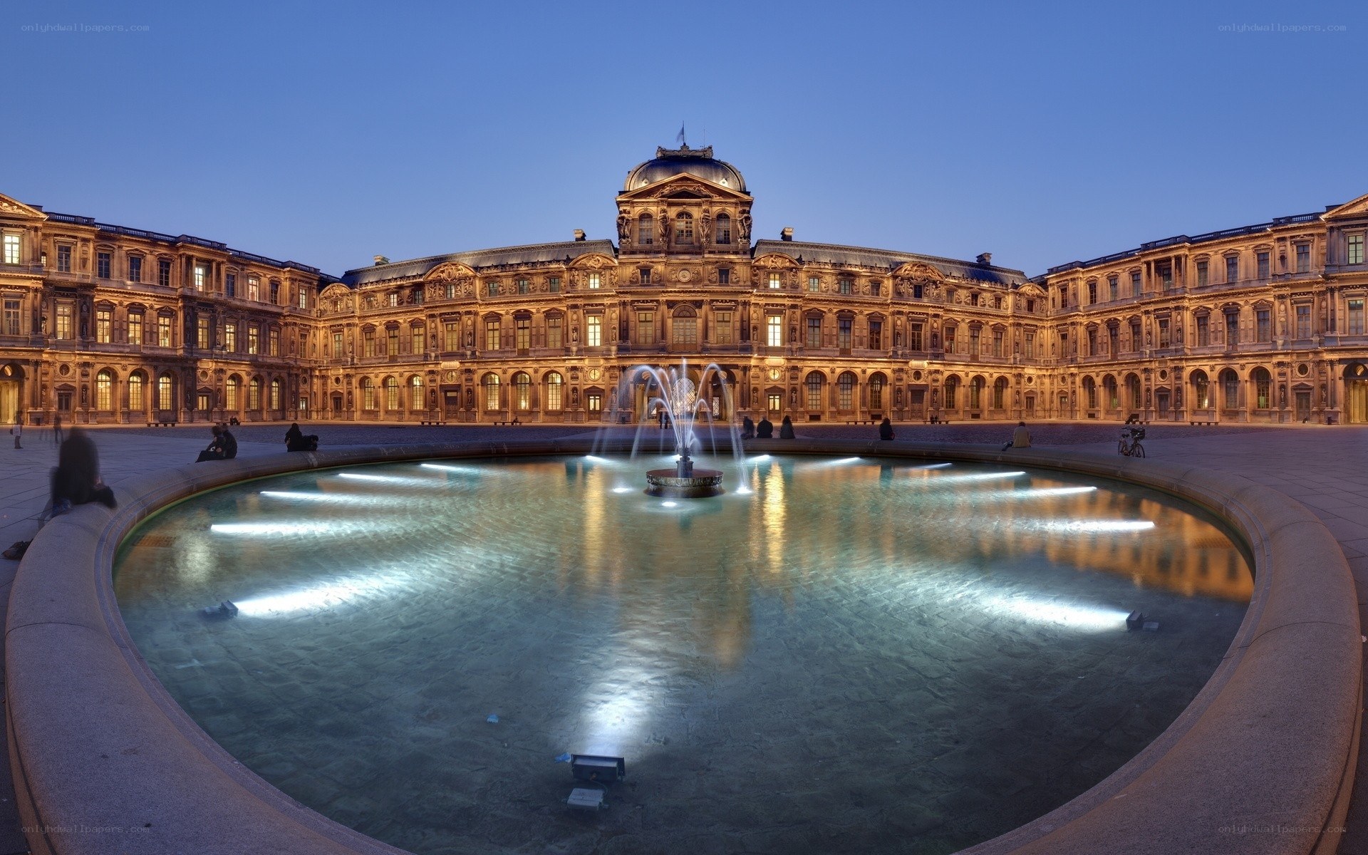 Louvre courtyard at dusk