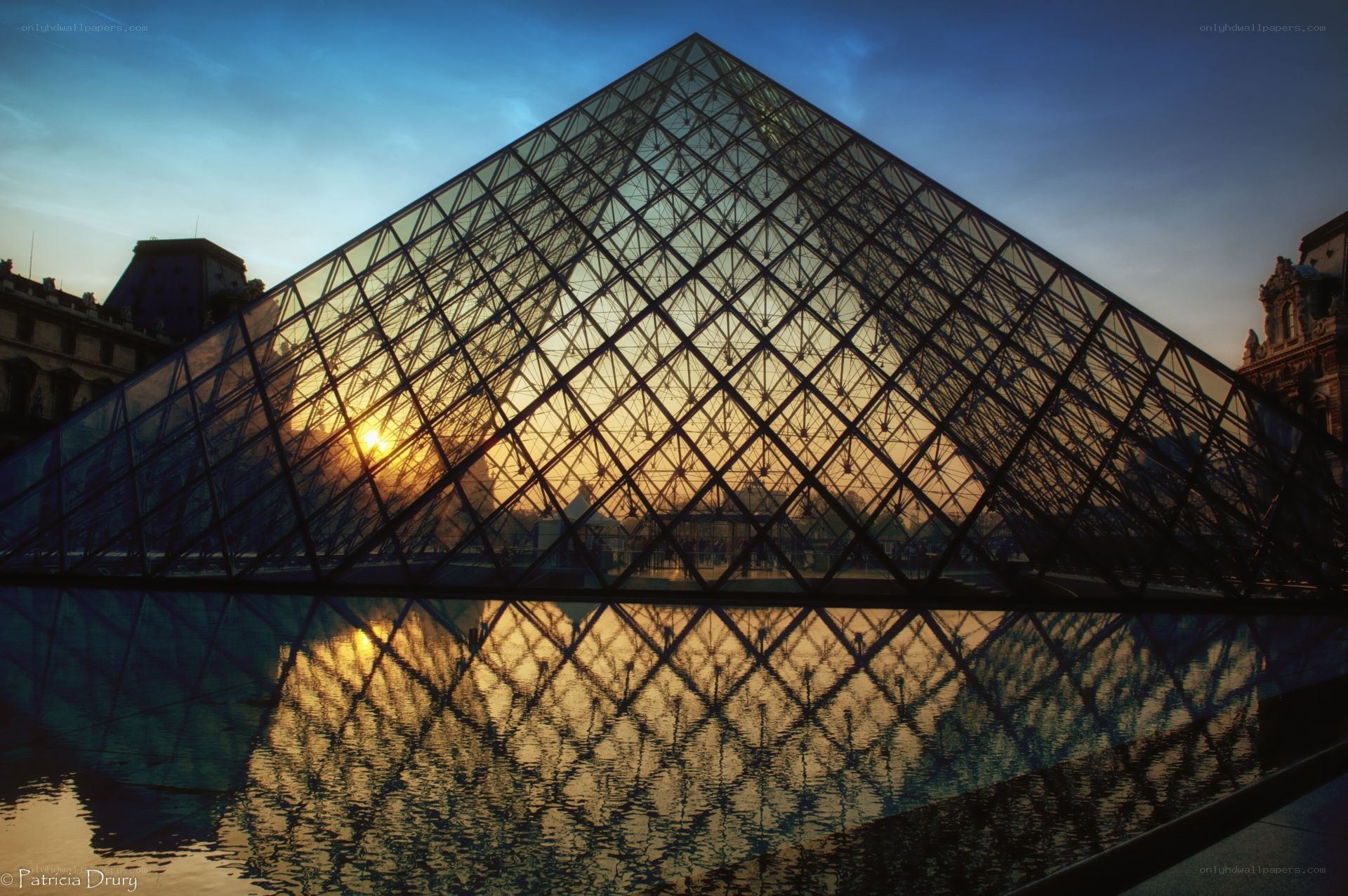 Louvre Pyramid at sunset