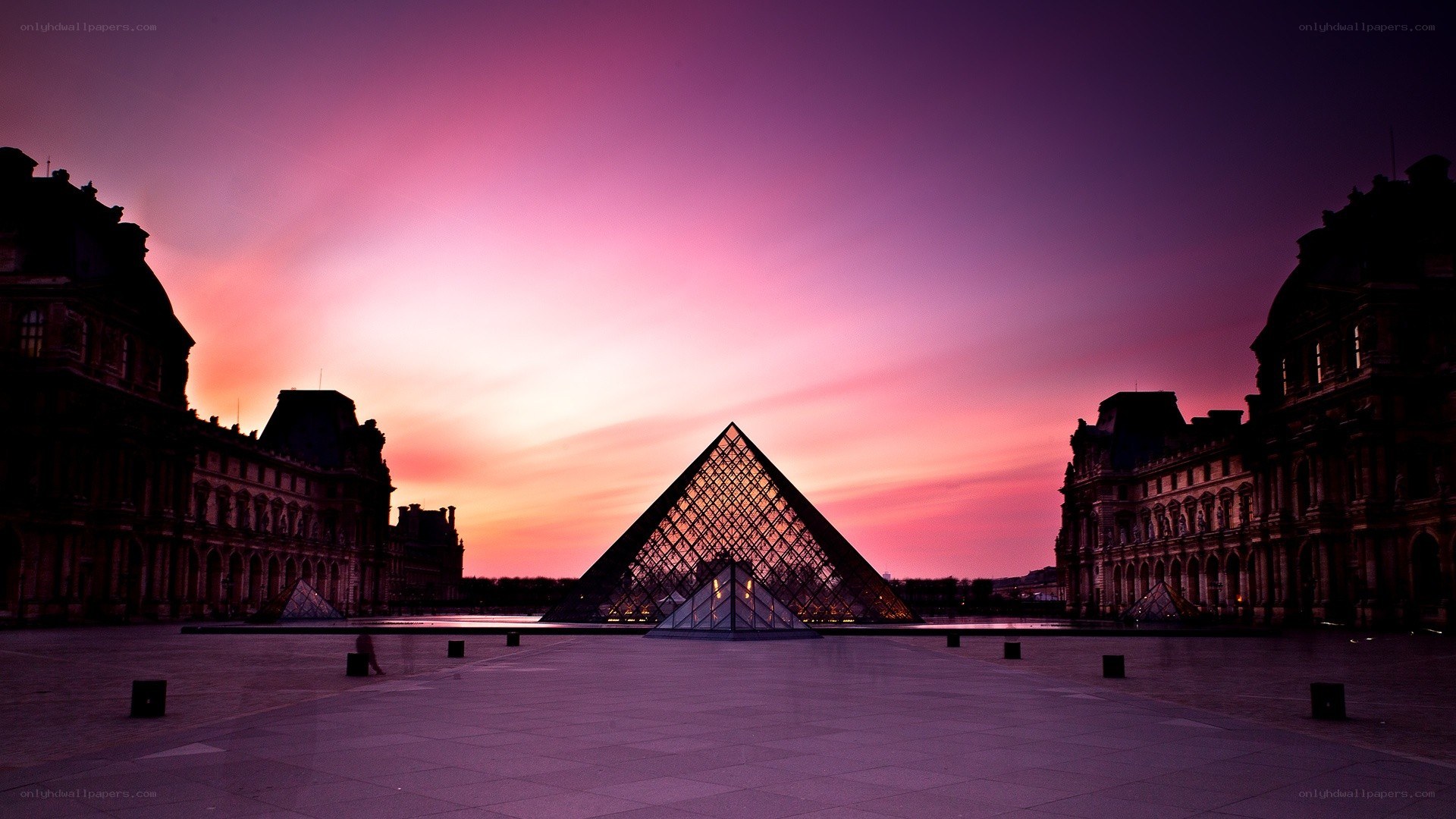 Louvre Pyramid at sunset