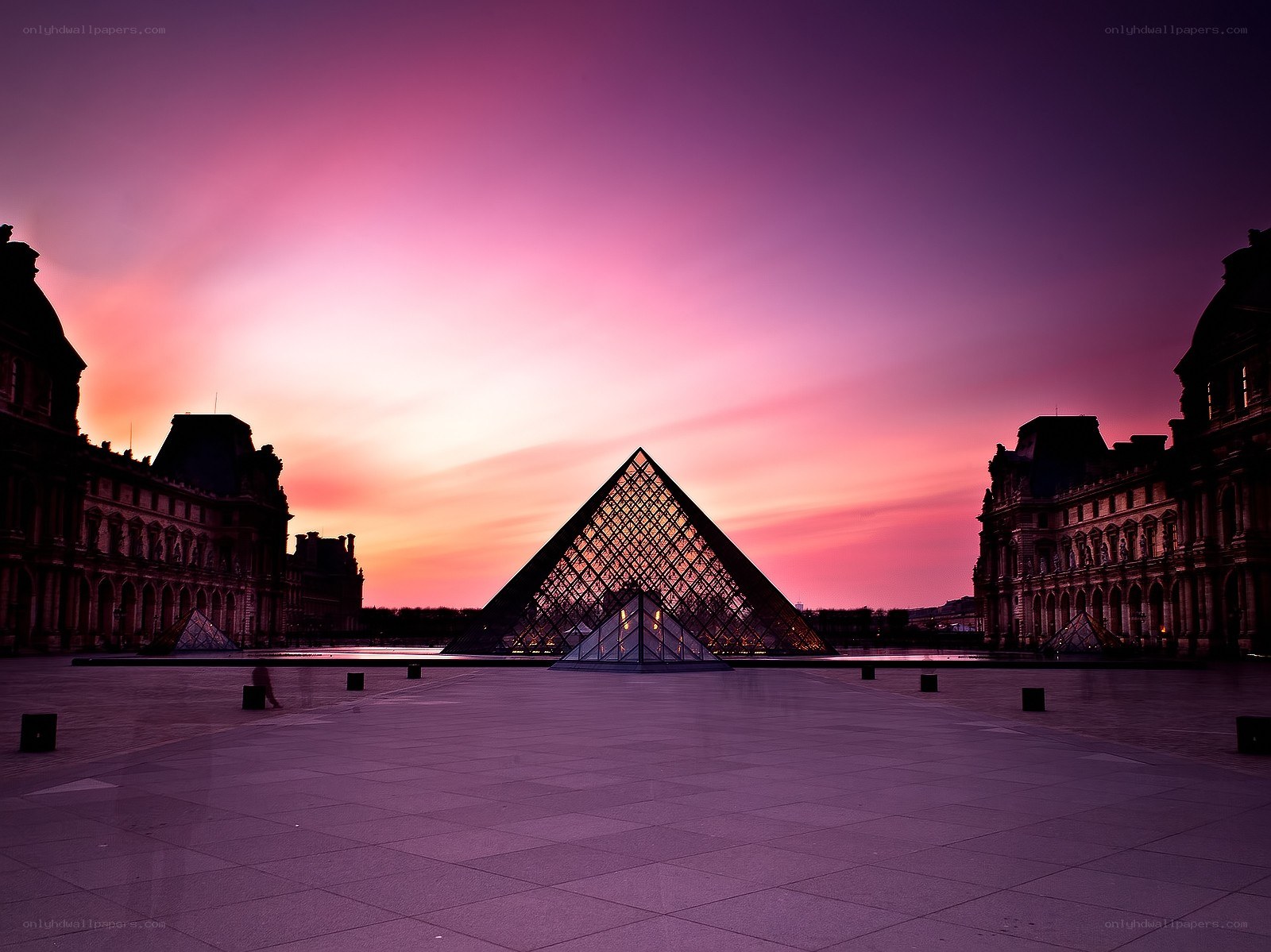 Louvre Pyramid at sunset