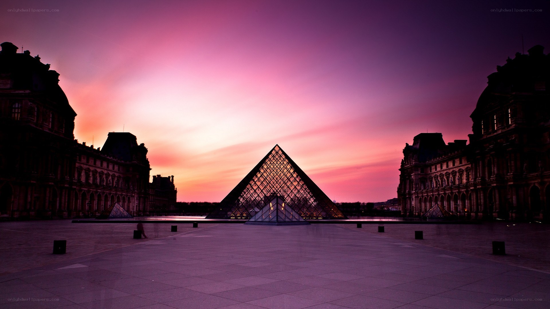 Louvre Pyramid at sunset