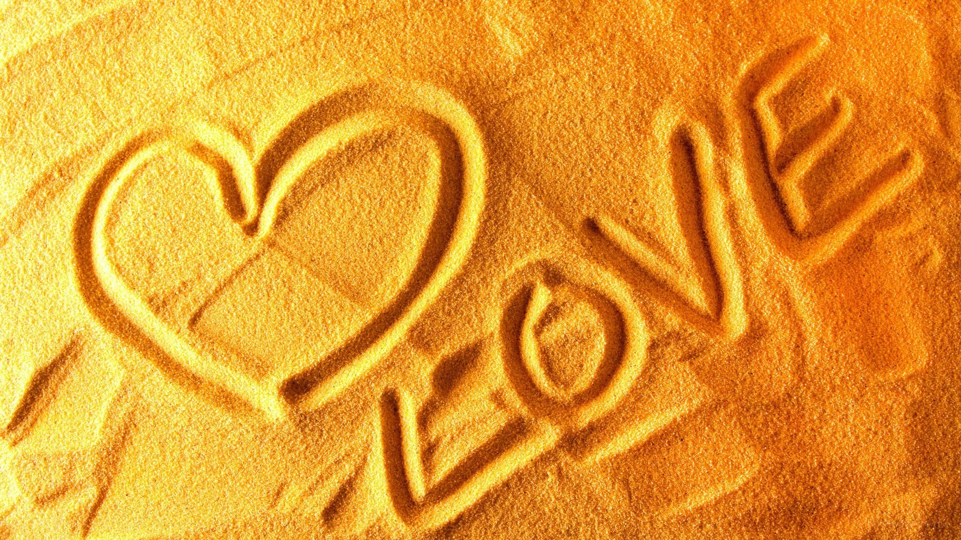 Love carved in sand