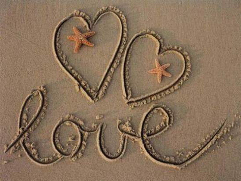 Love hearts drawn in the sand