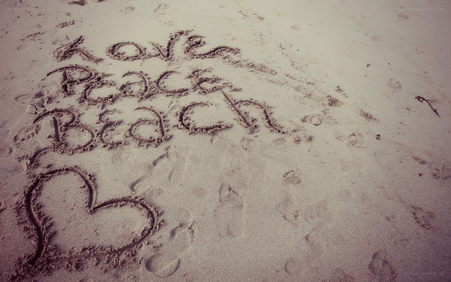 Love Peace Beach message in sand