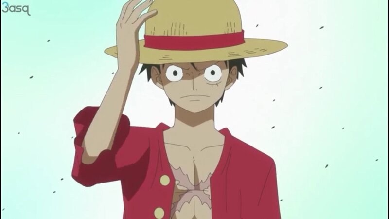 Luffy salutes with straw hat