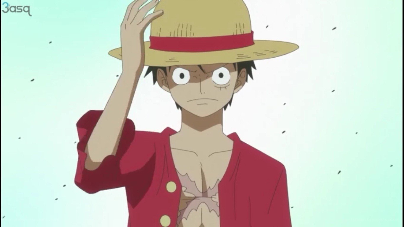 Luffy salutes with straw hat