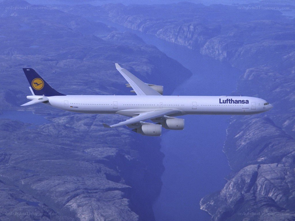 Lufthansa airplane flying over mountains