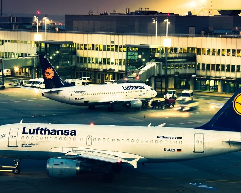Lufthansa Airplanes at Airport — White, Dramatic, Night, Photograph, Terminal Building