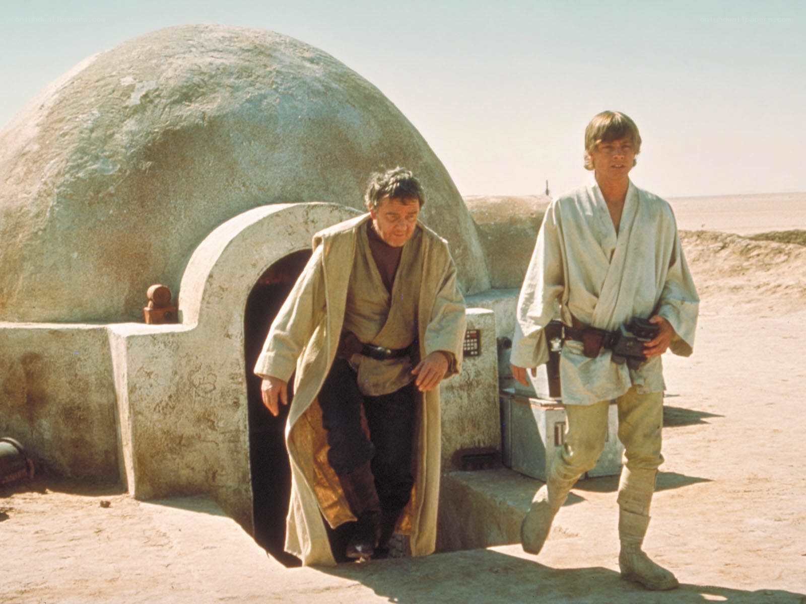Luke and Obi-Wan exit hut
