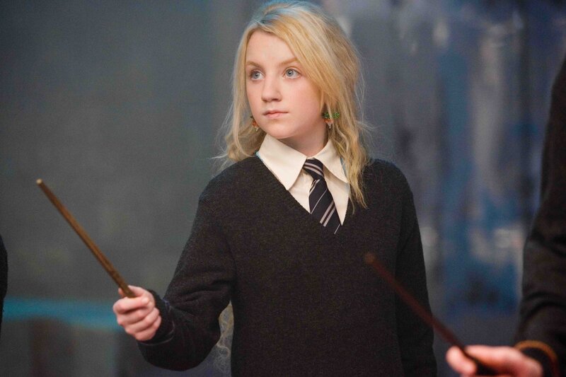 Luna Lovegood holding a wand