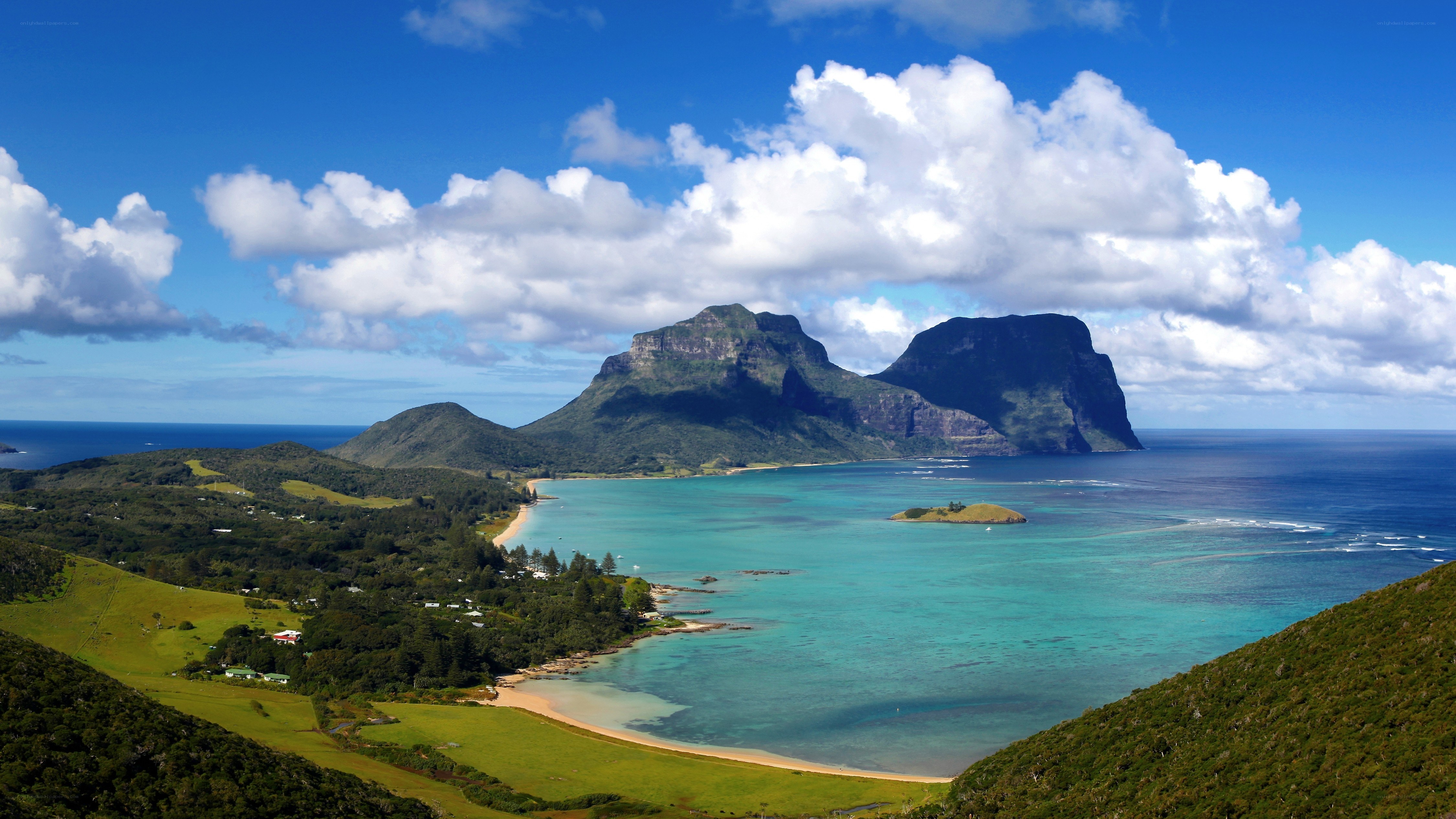 Lush coastal bay with mountains