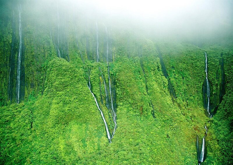 lush green cliffs with waterfalls