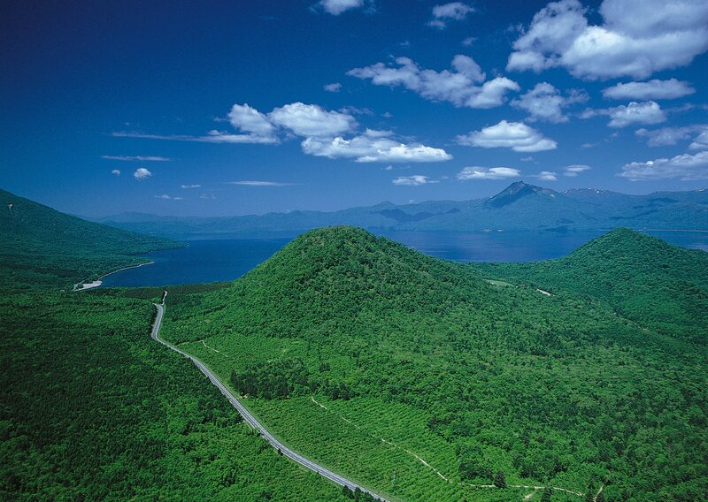 Lush green hills and lake landscape
