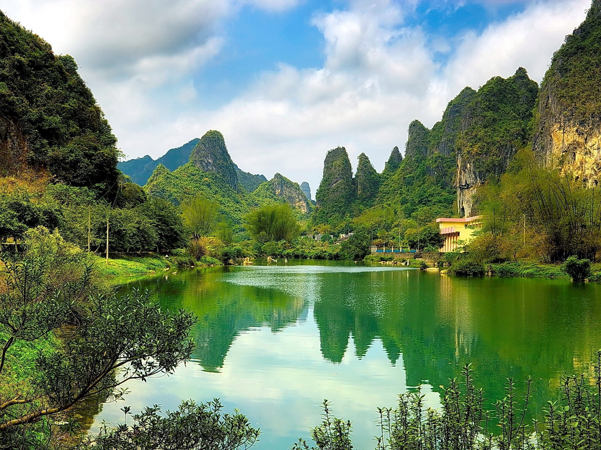 Lush karst landscape with lake