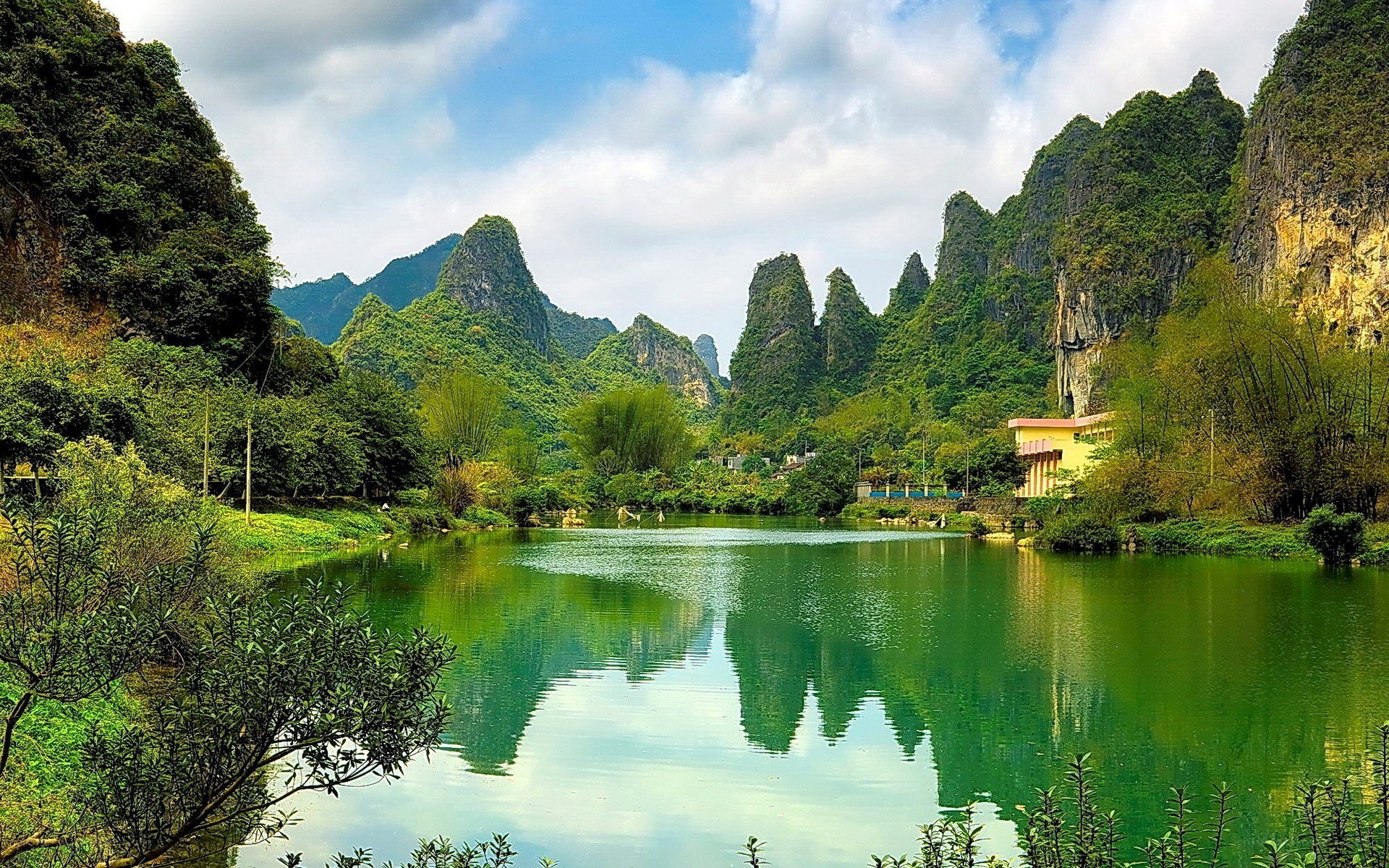 Lush karst landscape with lake