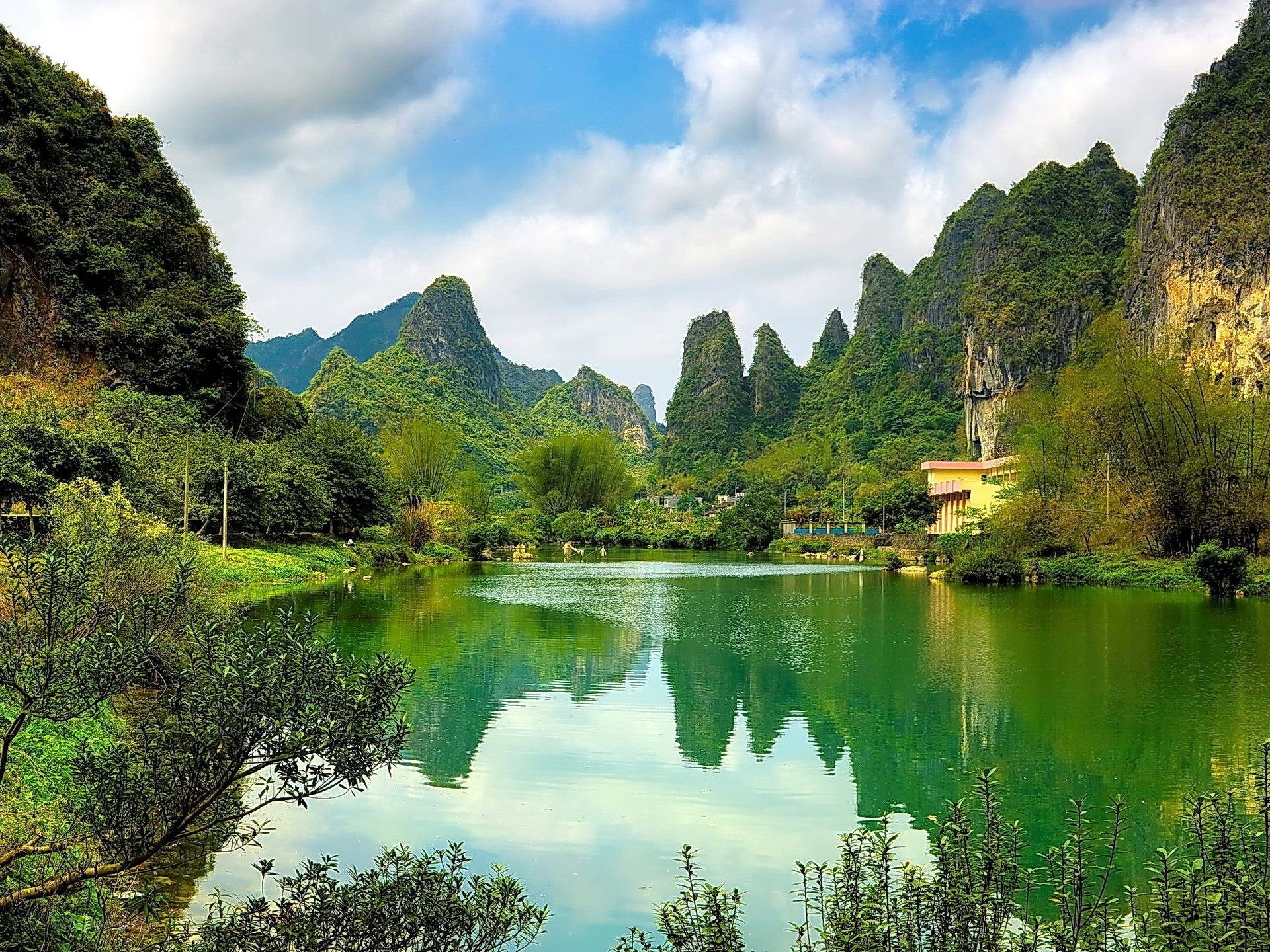 Lush karst landscape with lake