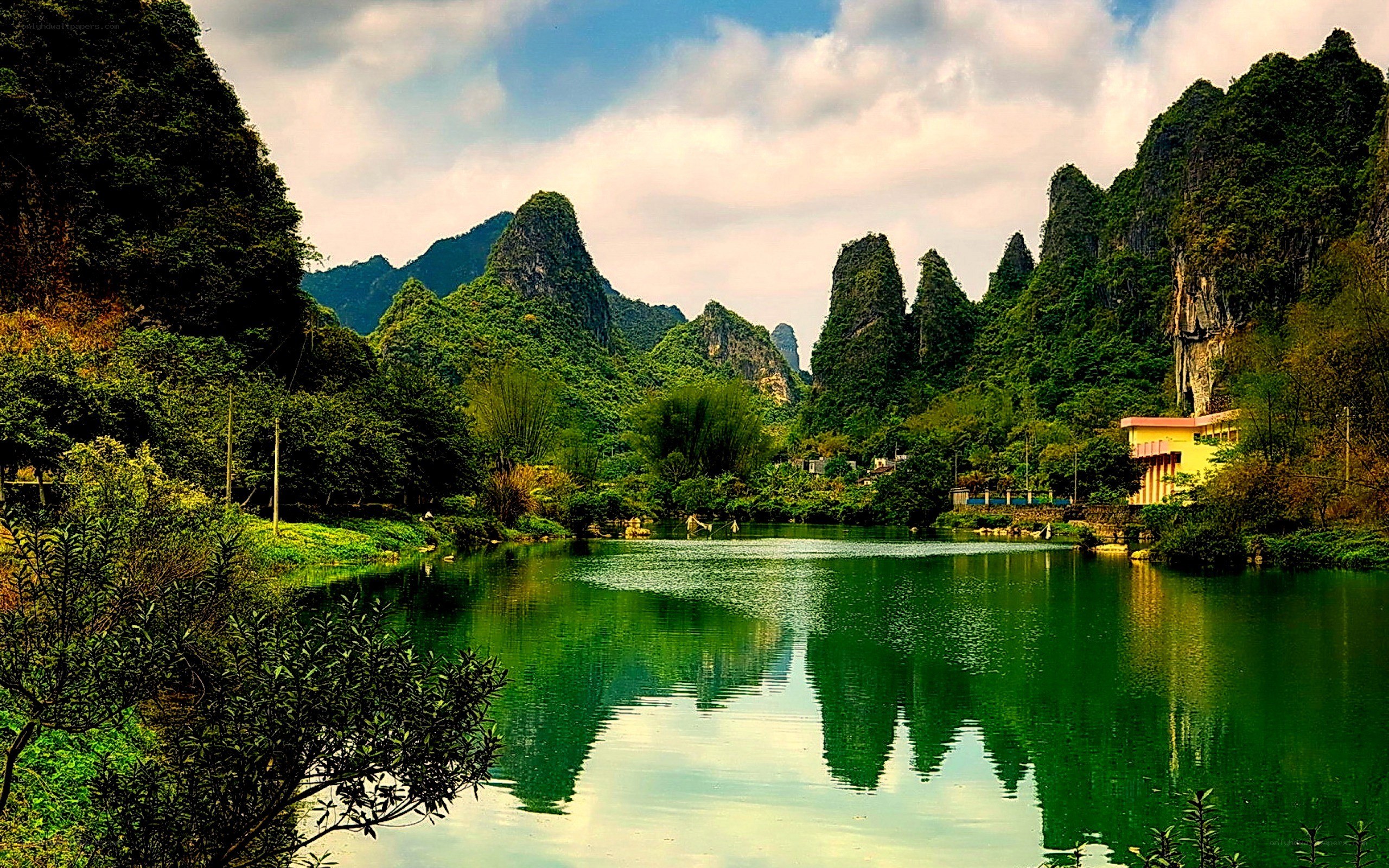 Lush karst landscape with lake