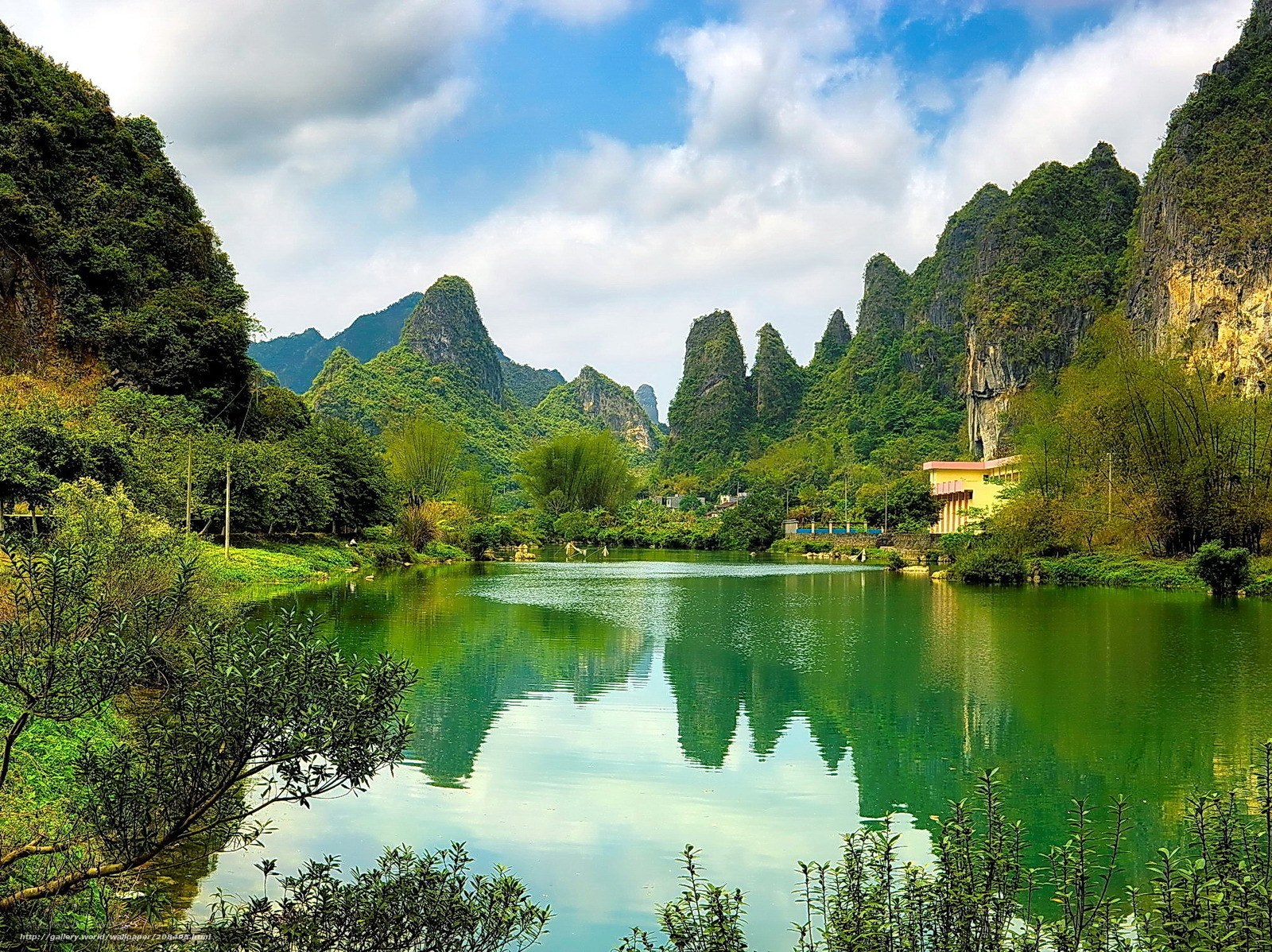 Lush karst landscape with lake