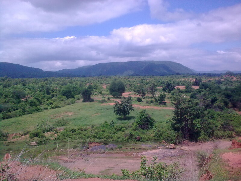 Lush valley with distant mountains