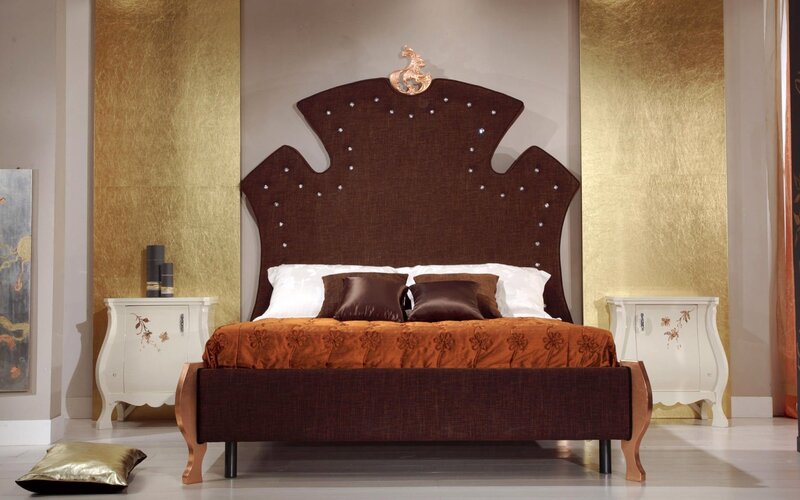 luxury bedroom with ornate headboard