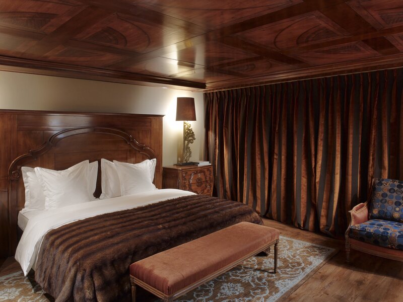 luxury bedroom with wooden ceiling