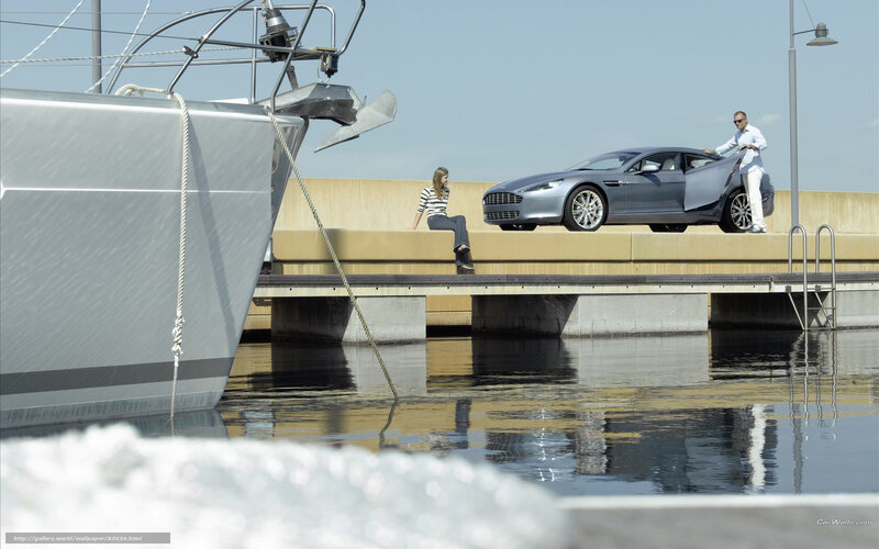 Luxury car and yacht at dock