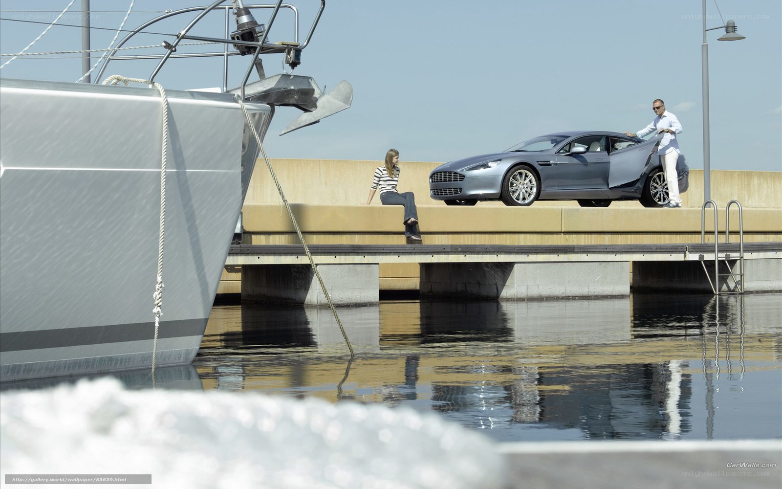 Luxury car and yacht at dock