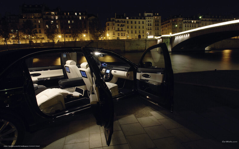 Luxury car at night by the river