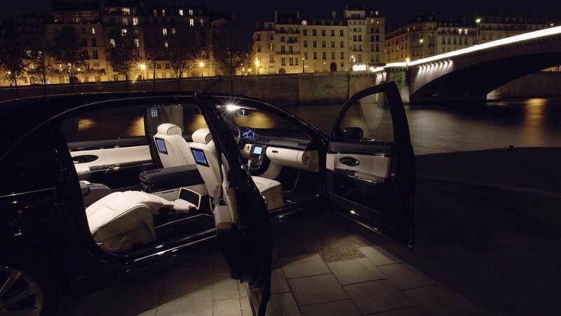 luxury car by river at night