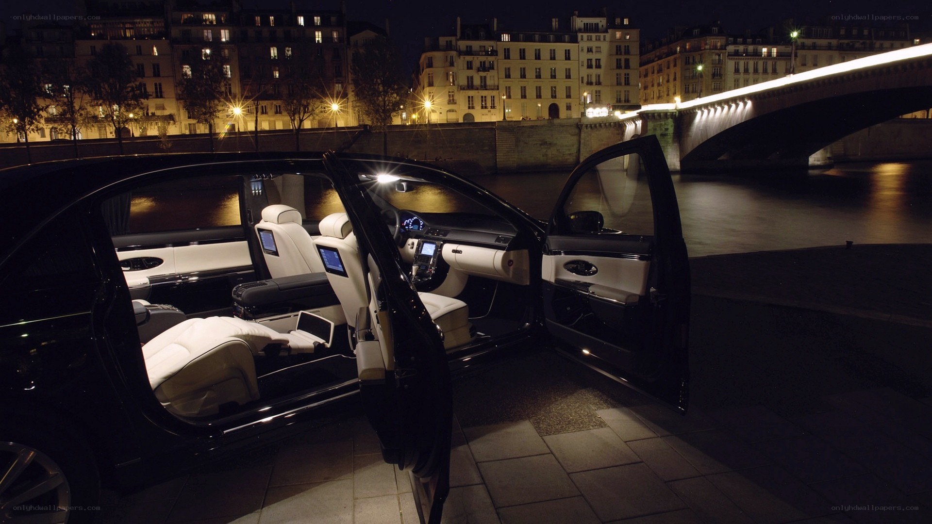 luxury car by river at night