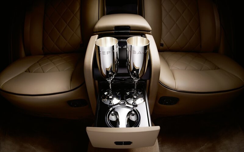 Luxury car interior with champagne flutes