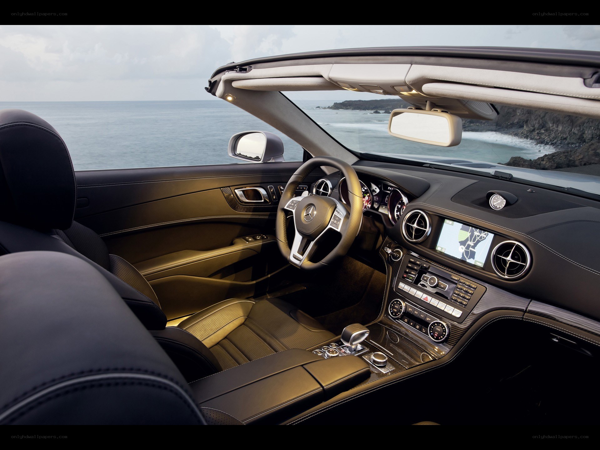 Luxury car interior with ocean view