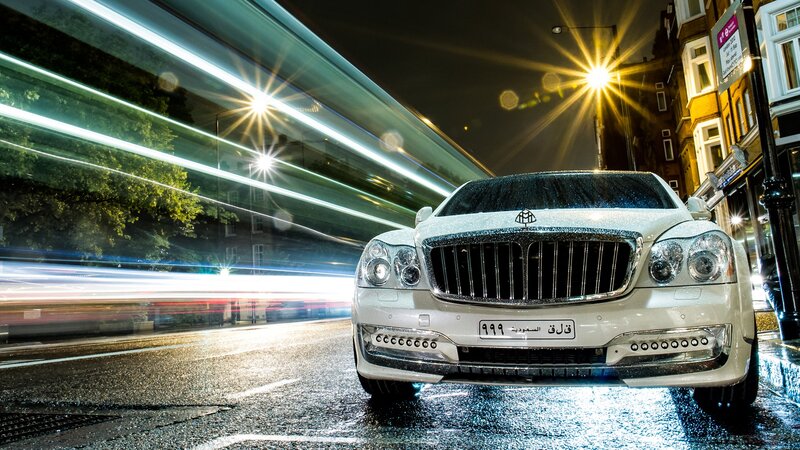 Luxury car on wet city street