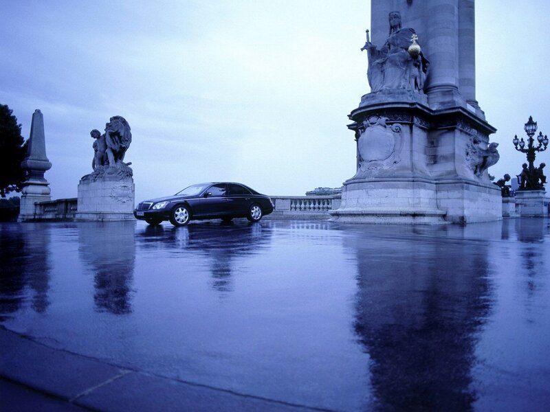 Luxury car on wet plaza