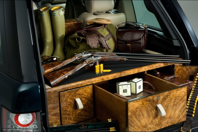 luxury car trunk with hunting gear
