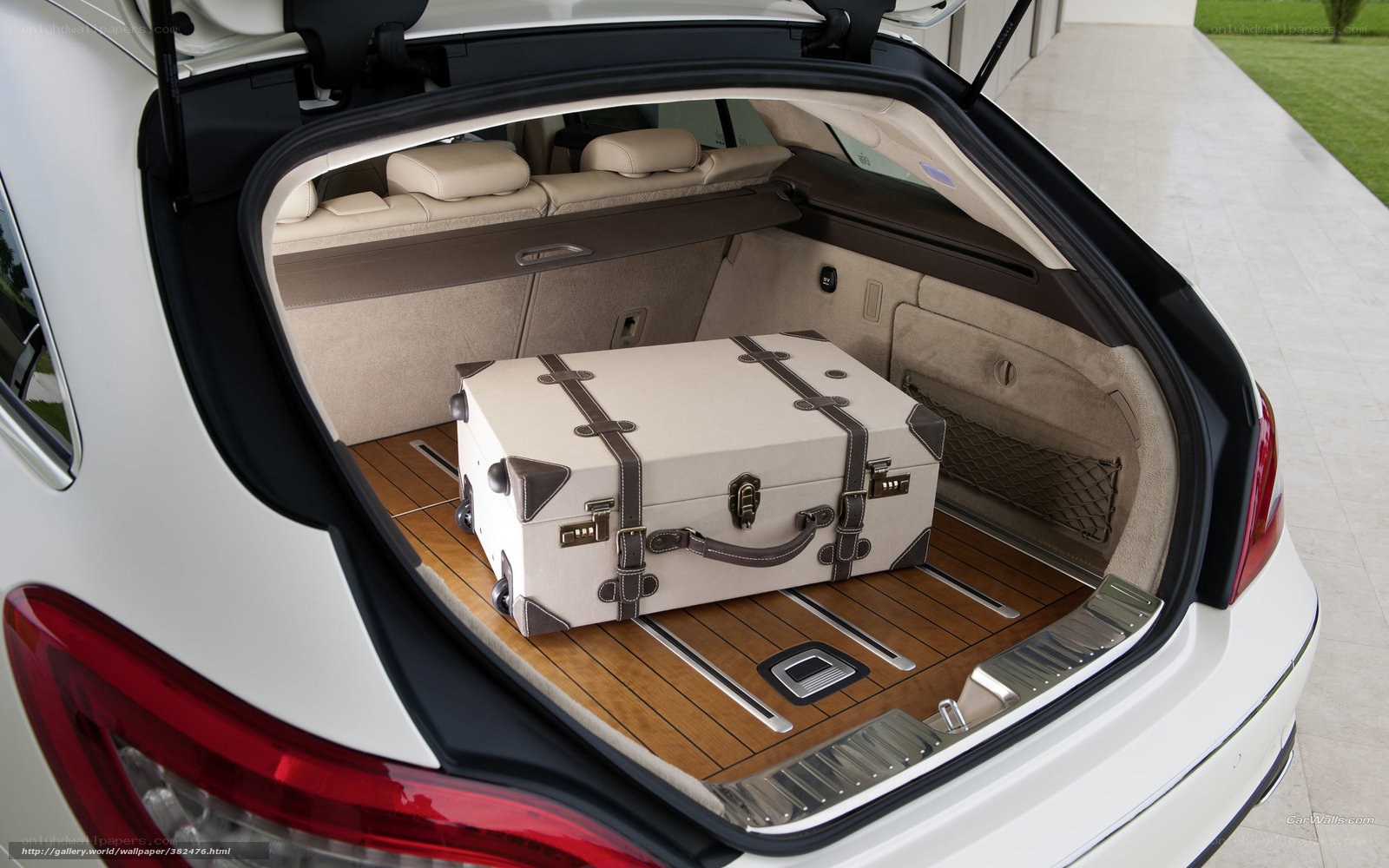 luxury car trunk with suitcase