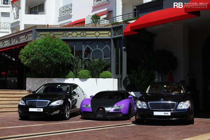 Luxury cars at a hotel entrance