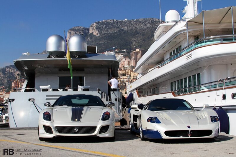 Luxury cars at a marina
