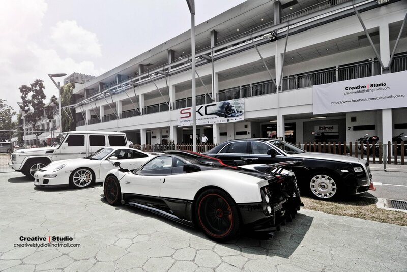 Luxury cars at a race track