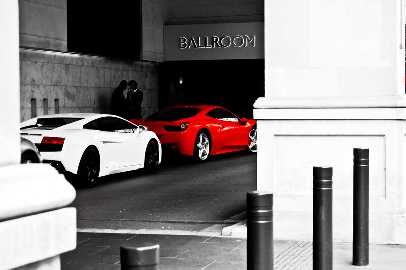 Luxury cars at ballroom entrance